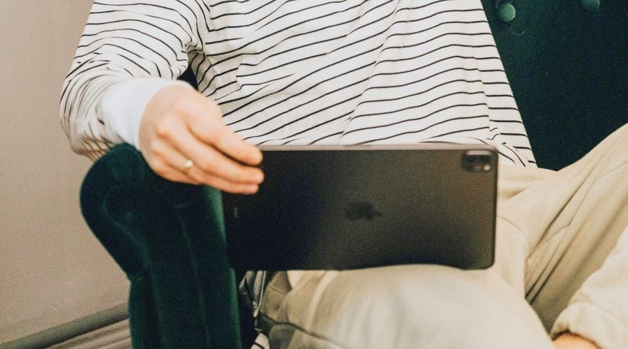 Man watching virtual conference on ipad