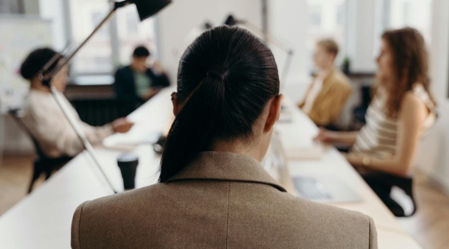 Back of womans head at conference table