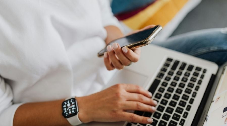 Woman writing an email on her phone